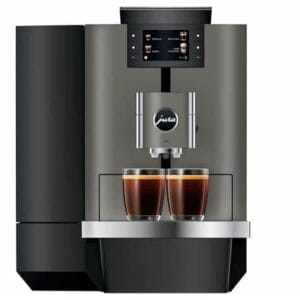 JURA X10 Dark Inox coffee machine side view showcasing water tank and latte brewing process