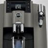 Close-up of JURA W8 Dark Inox coffee machine showing Coffee Eye technology and milk frother.